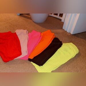 Quantity 3  Medium leggings colors are orange, lime green and light pink